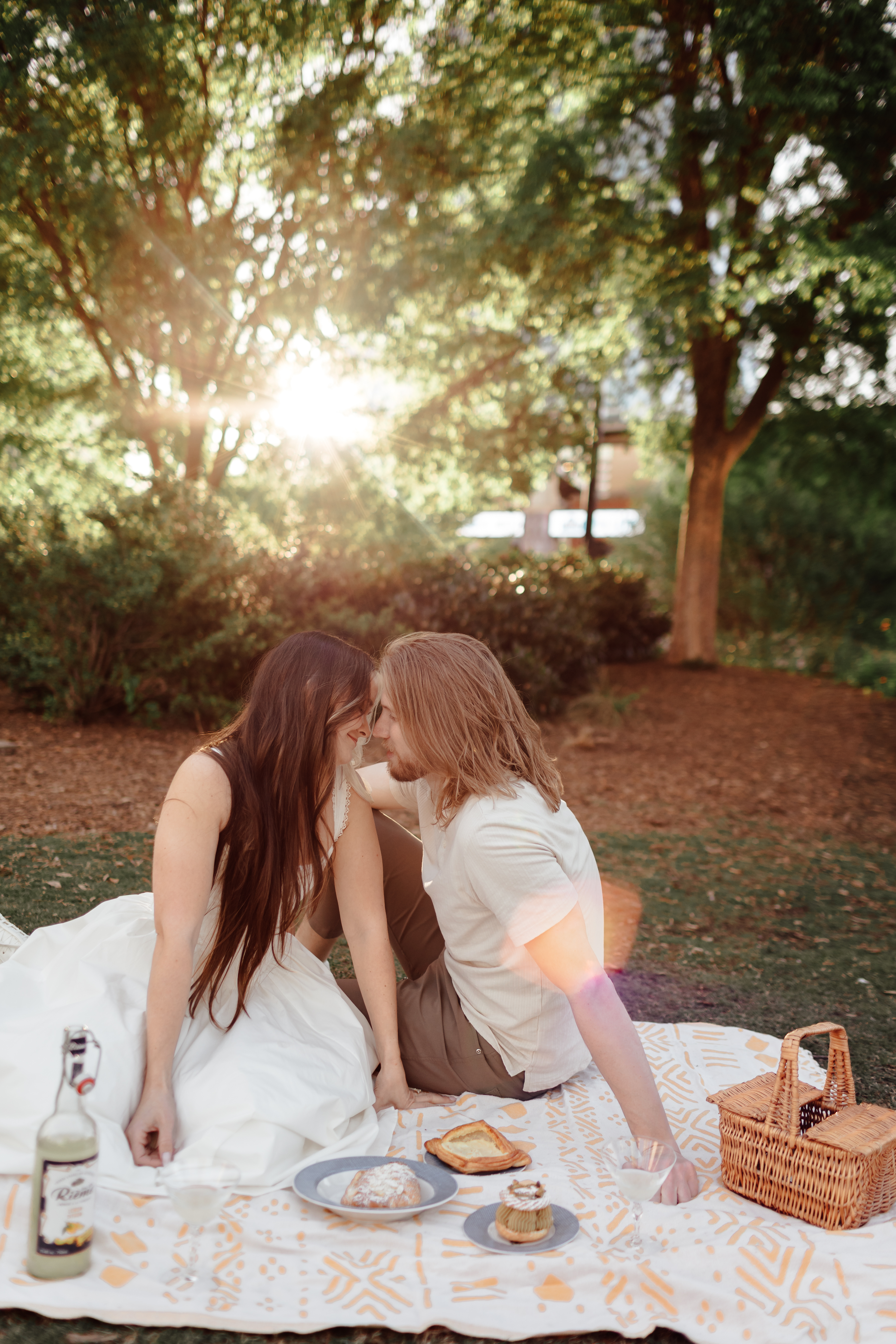 Meg and Ryan sitting together at a picnic